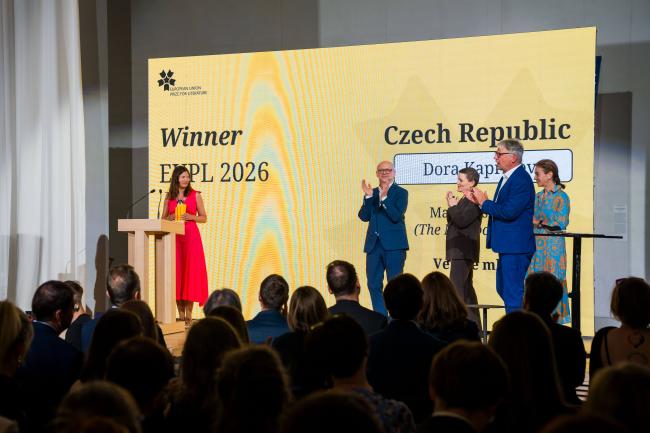 EUPL 2026 Laureate Dora Kapralova receiving her prize on stage.
